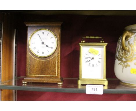 A brass cased carriage clock with key; and a mahogany cased mantel clock 