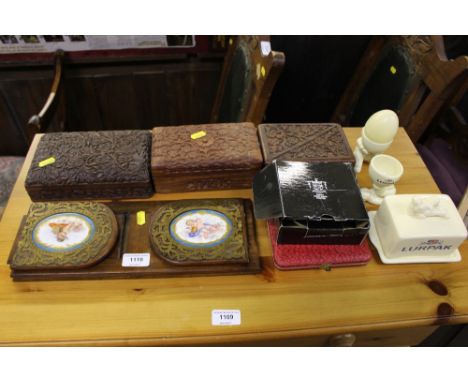 A Victorian sliding book rack inset with porcelain panels decorated with cherubs; together with three hardwood boxes; a pewte