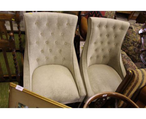 A pair of upholstered button back chairs 
