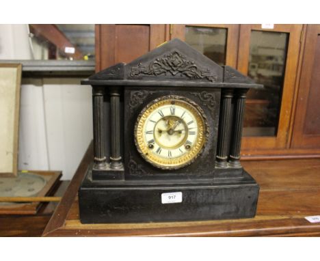 A late Victorian black slate two hole mantel clock  AF