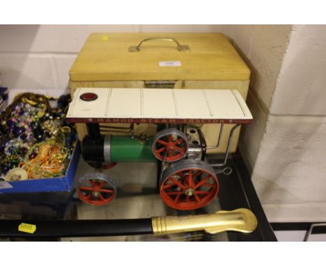 A Mamod steam tractor with wooden storage box 