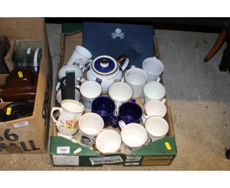A box of commemorative mugs, and a teapot etc.