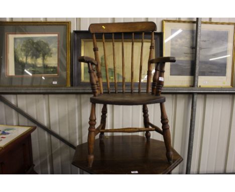 An elm seated stick back elbow chair 