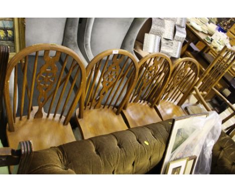 A set of four stick and wheelback kitchen chairs 