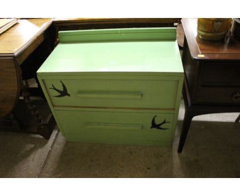 A green painted two drawer chest together with a stick back kitchen chair 