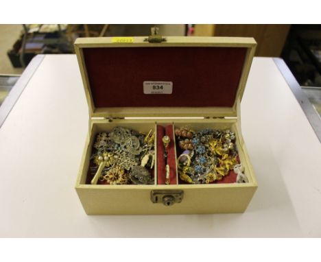 A jewellery box containing dress ring, bracelets, brooches etc. 