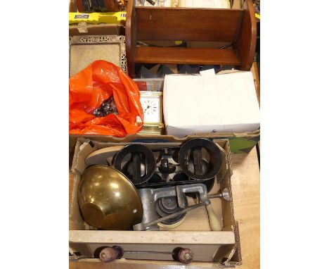 Two boxes of miscellaneous items to include a brass carriage clock, cast iron weighing scales, wooden book trough, etc