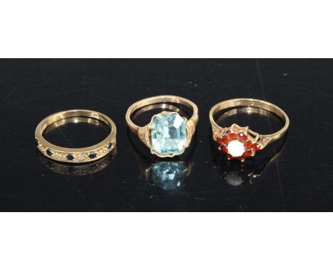 A 9ct gold, opal and garnet flower head cluster ring, size O; together with a 9ct gold, sapphire and diamond half-hoop ring; 