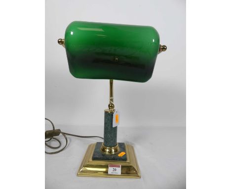 A green polished hardstone and brass banker's type desk lamp, having a green glass shade, height 35cm