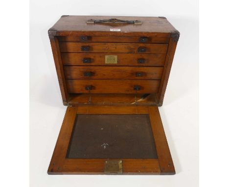 A vintage table top chest of drawers, containing a collection of watchmaker's tools, width 40cm