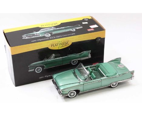 A Sun Star Platinum collection 1:18 scale 1960 Plymouth Fury open convertible, in green, with folded down roof, a/f
