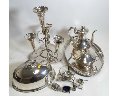 A collection of silver plated items, to include a four-piece cruet set, table epergne, and a cloche 
