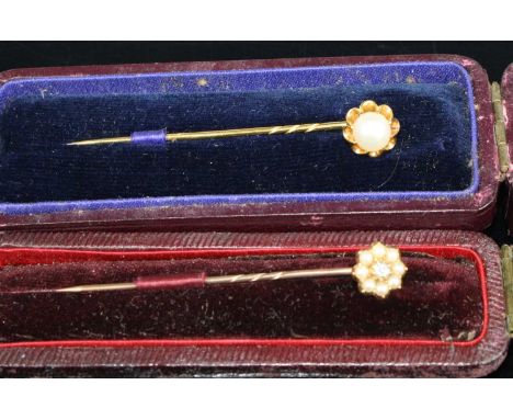 A Victorian yellow metal, seed pearl and old cushion cut diamond set tie-pin, in fitted case, tests as approx 14ct gold; toge