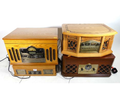 A combination record and CD player in wooden case, w.45cm; together with three others  