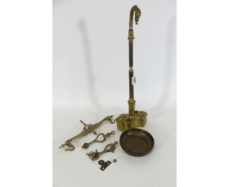 A set of early 20th century brass weighing scales, the beam in the form of two dolphins