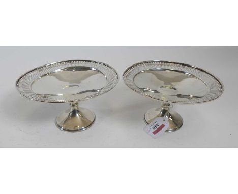 A pair of George V silver comports, each having a pierced rim, on weighted circular foot, William Hutton &amp; Sons Ltd, Birm