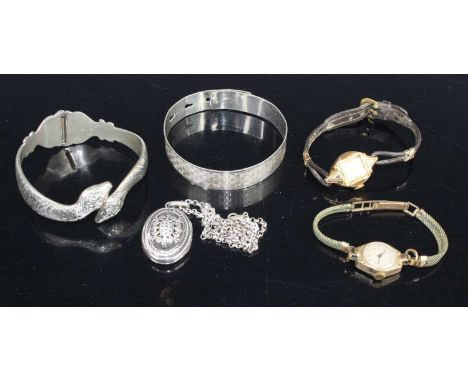 A lady's vintage 9ct gold cased manual wind wristwatch; a gilt metal cased example; together with a silver bangle, white meta