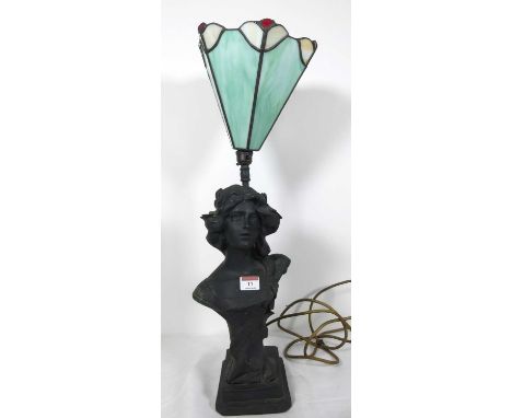A 20th century figural table lamp, having a Tiffany style glass shade, height 59cm