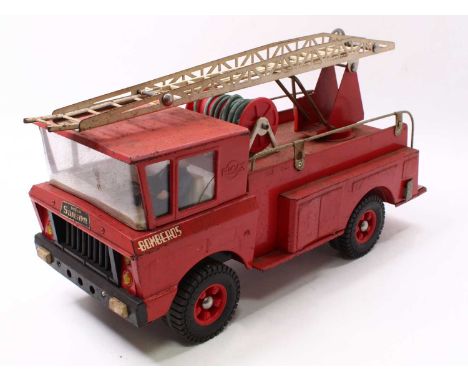 A Rico Toys of South Africa Bomberos Tonka-style fire engine comprising of a red pressed steel body with a tin plate extendin