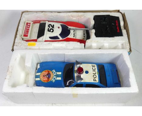 A Corgi Interstate Crimebuster remote control car, together with a Radio Shack radio control car