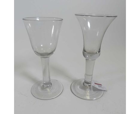 An 18th century wine glass having a bell shaped bowl, and domed foot,height 19.5cm, together with another having a round funn