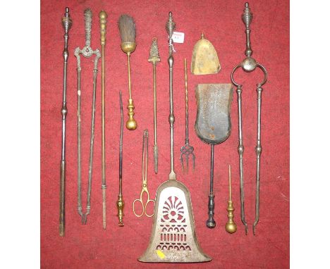 A collection of Georgian and later polished steel and brass fire tools