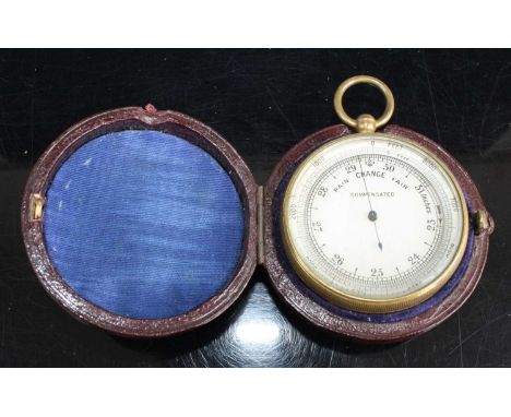 A gilt metal cased pocket barometer, having unsigned silvered dial and housed in leather travel case, gross dia.6cm