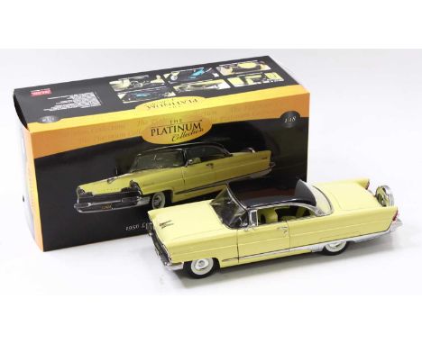 A Sun Star Platinum collection 1:18 scale model of a 1956 Lincon Premierer with a hard top, in Presidential black, and sunbur