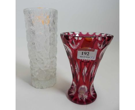A Whitefriars style textured clear glass sleeve vase height 18cm, together with a ruby overlaid cut glass vase (2)