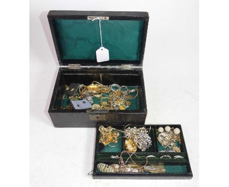 An early 20th century black leather clad jewellery box, containing a collection of costume jewellery, to include gilt metal c