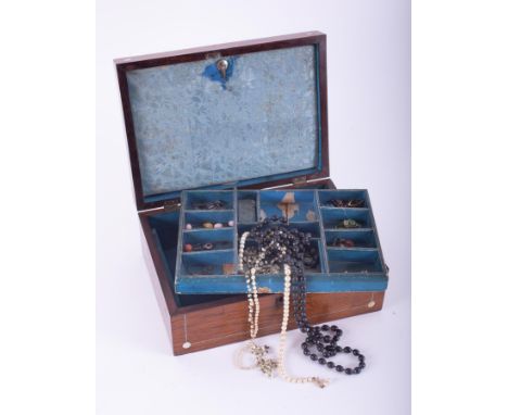 A mahogany jewellery box inlaid with mother of pearl decoration and containing a small quantity of costume jewellery to inclu