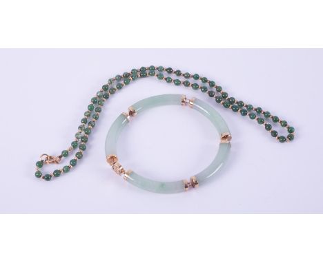 A 9ct yellow gold link bracelet with curved jade sections, length approx. 20cm, 22.41gm and a 9ct yellow gold bead &amp; jade