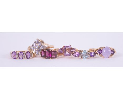 A mixed bag of six 9ct yellow gold gem set rings to include amethyst, lavender jade, pale tanzanite, etc, total weight 14.37g