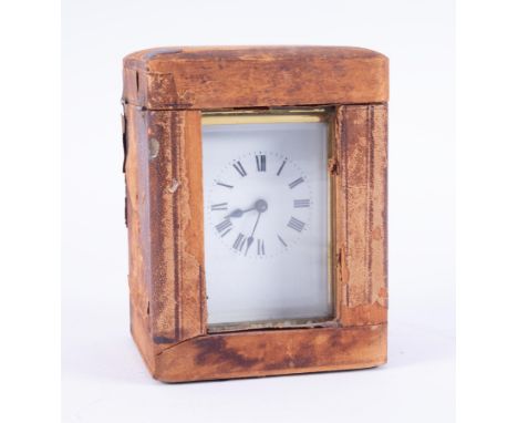 A French cased carriage clock, height including handle 15cm, with key.