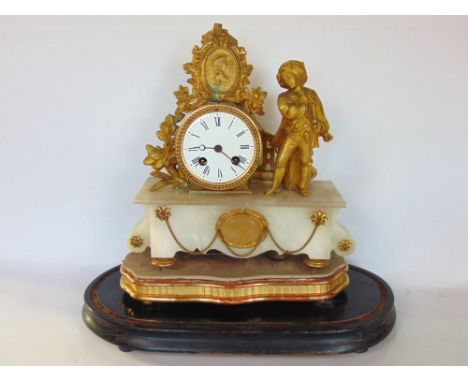 French gilt metal and alabaster figural mantle clock, the 7cm two train dial flanked by a young man in period dress under a c