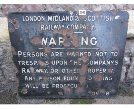 A vintage enamel London Midland & Scottish Railway Company warning notice of rectangular form mounted on a wooden board, 56 c