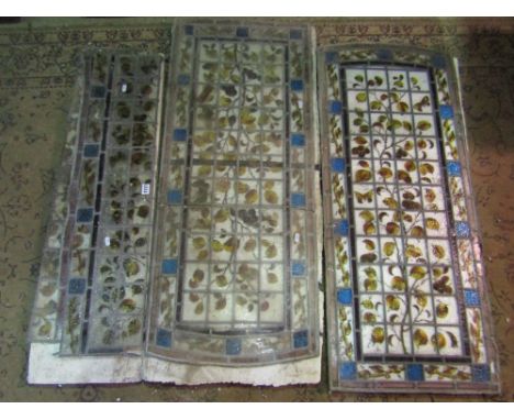 Three reclaimed stained/leaded light window panels with hand painted leaf and stem decoration (four sections in total, one pi