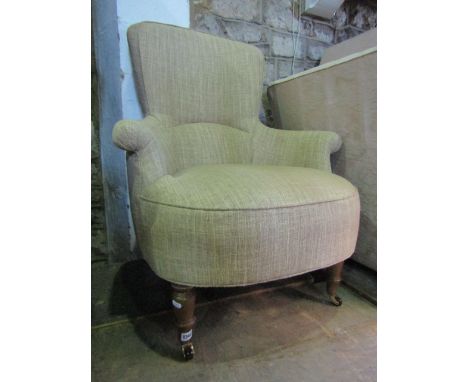 A contemporary drawing room chair in the Victorian style with shaped outline, swept and rolled arms and oatmeal ground uphols