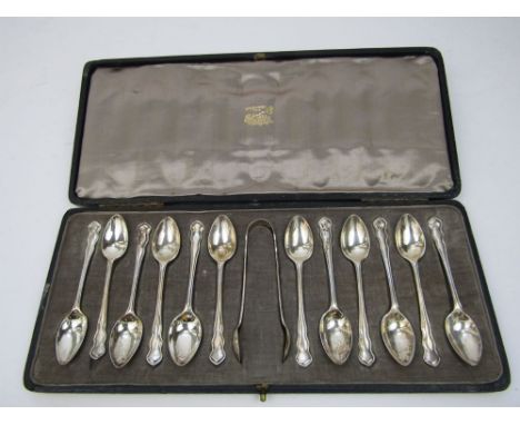 A good suite of twelve silver teaspoons and a pair of sugar nips, maker R & Co, London early 20th century, 6oz approx cased