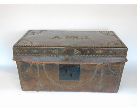 19th century studded leather trunk, the lid with monogram AMBJ, 61cm wide