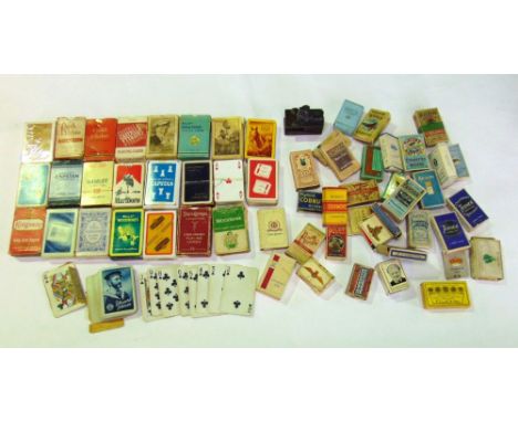A collection of vintage cigarette boxes, vesta cases; together with several packs of playing cards all advertising brands of 