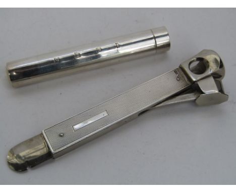 Smoking interest - Engine turned silver cased cigar cutter together with further cylindrical silver cigar case (2)
