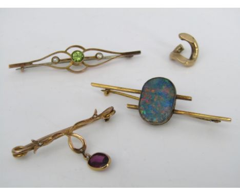 A 15ct gold bar brooch set with a large opal, another in 9ct with seed pearls and green stone and a further unmarked example 
