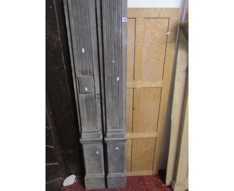 A pair of tall reclaimed architectural pilasters with fluted columns and doric capitals, approx 9.5 ft in height, together wi