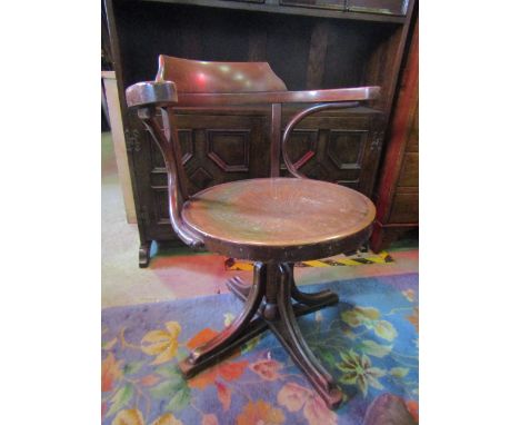 A vintage bentwood swivel office/desk chair with shell panelled seat and swept quadruped 