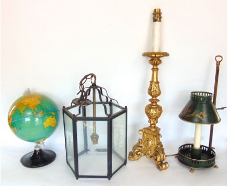 A collection of lighting to include a tollware lantern, a hexagonal hall lantern, a rococo type gilt table light and an illum