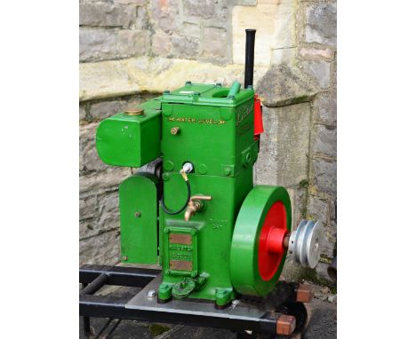 "The Lister" stationary engine manufactured by R A Lister & Co Ltd, Dursley, England, number 0, 1 1/2 HP, mounted on a hand c