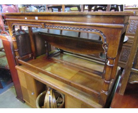 A reproduction oak console/hall table, the rectangular top raised on turned gun barrel and block supports, partially united b