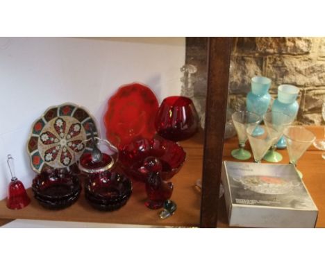 Collection of cranberry type glass to include a dessert service, large goblet, sucrier, novelty duck paperweight; together wi