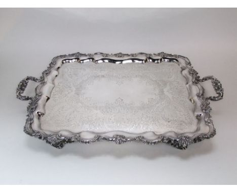 Good quantity 19th century silver plated twin handled tray, cast with various scallop shells, raised upon four feet, the plat